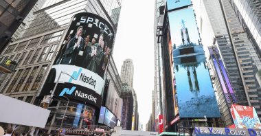 SpaceX founder and CEO Elon Musk is shown on a screen celebrating the company’s debut on the Nasdaq market in New York, New York, U.S., June 12, 2026. (EPA Photo)