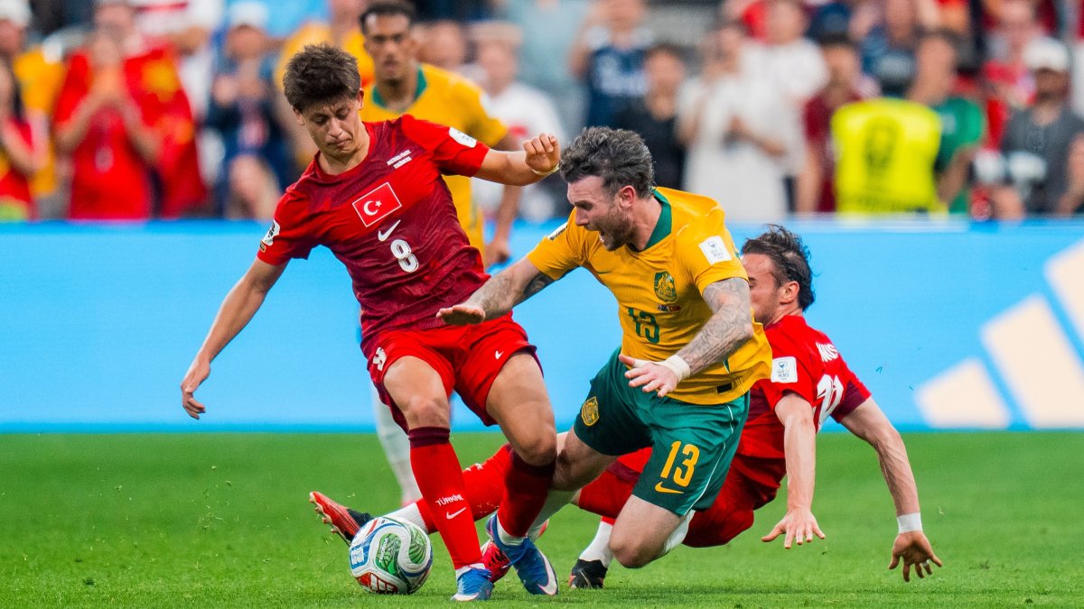 Türkiye's Arda Güler tackles Aiden Oneill of Australia during a FIFA World Cup 2026 match, in Vancouver, Canada, June 13, 2026. (EPA Photo)