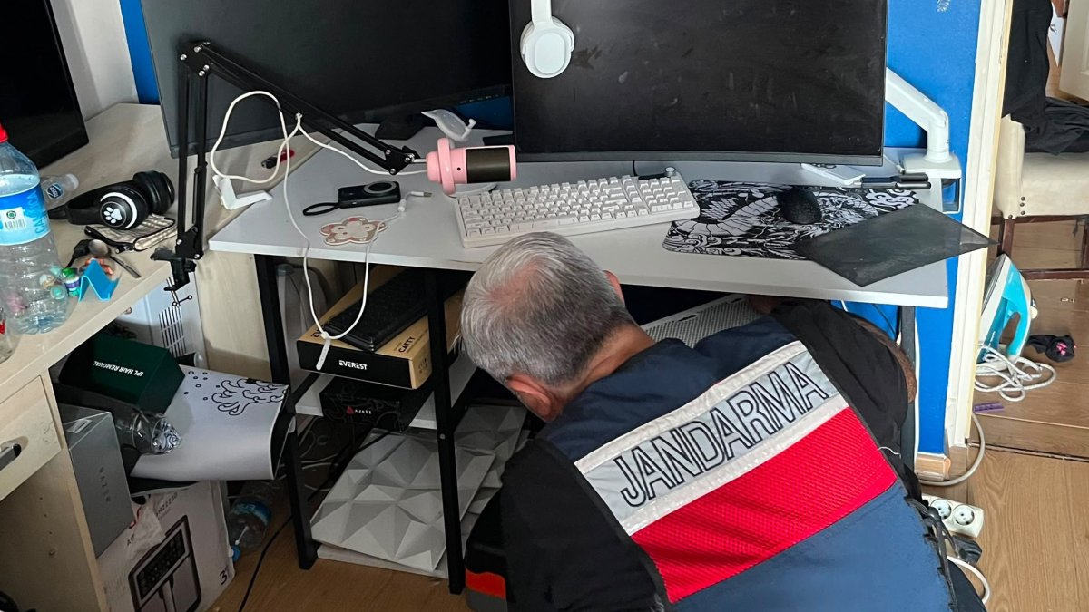 A gendarmerie officer examines digital evidence during a cybercrime operation, Istanbul, Türkiye, June 13, 2026. (AA Photo)
