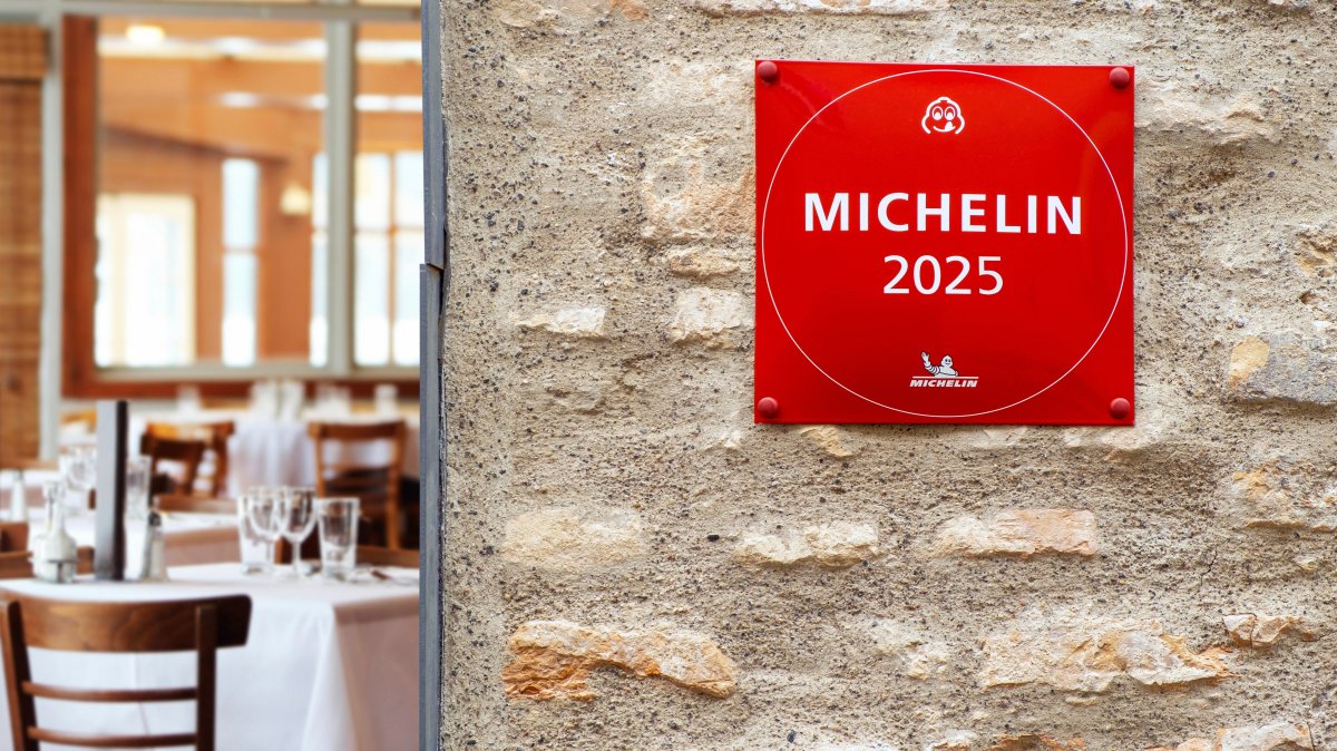 A Michelin Guide star sign for restaurant excellence hanging on brick wall, Vilnius, Lithuania, Jan. 30, 2025. (Shutterstock Photo)