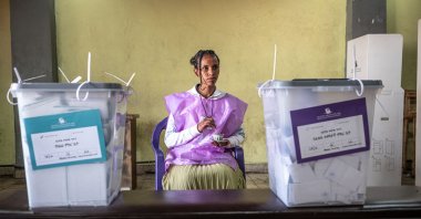 A National Election Board of Ethiopia (NEBE) official drinks coffee inside a polling station during the Ethiopian parliamentary elections, Kechene, Addis Ababa, Ethiopia, June 1, 2026. (AFP Photo)