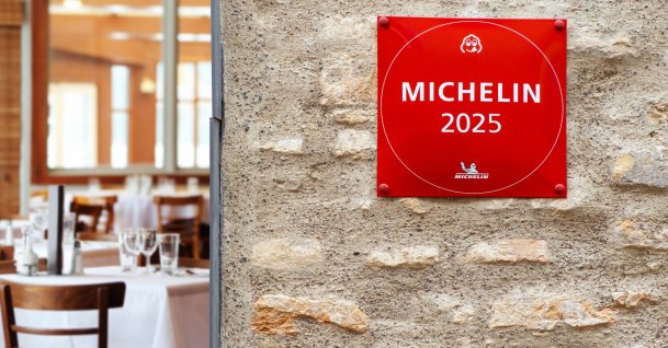A Michelin Guide star sign for restaurant excellence hanging on brick wall, Vilnius, Lithuania, Jan. 30, 2025. (Shutterstock Photo)