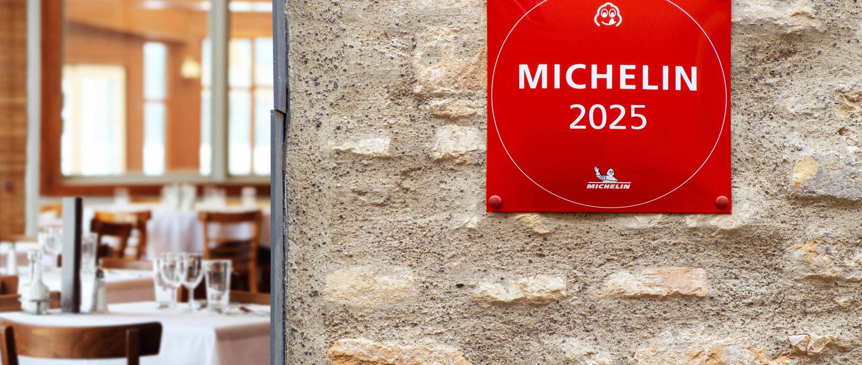 A Michelin Guide star sign for restaurant excellence hanging on brick wall, Vilnius, Lithuania, Jan. 30, 2025. (Shutterstock Photo)