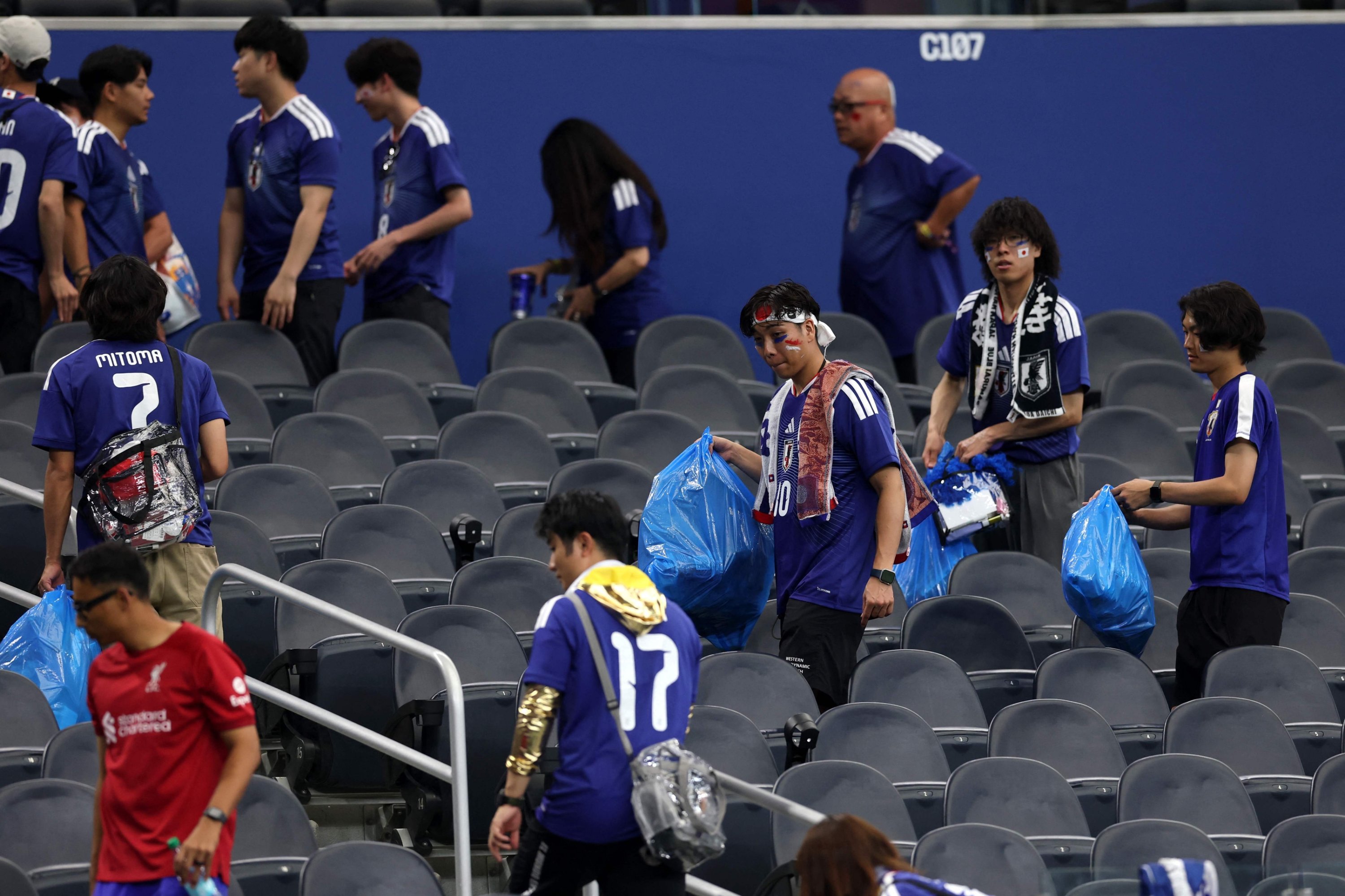 ‘Our culture’: Japan fans tidy World Cup stadium after match