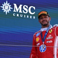 First-placed Scuderia Ferrari driver Lewis Hamilton of Britain celebrates with the trophy on the podium after the Formula One Grand Prix of Barcelona-Catalunya at Circuit de Barcelona-Catalunya track, Barcelona, Spain, June 14, 2026. (AA Photo)