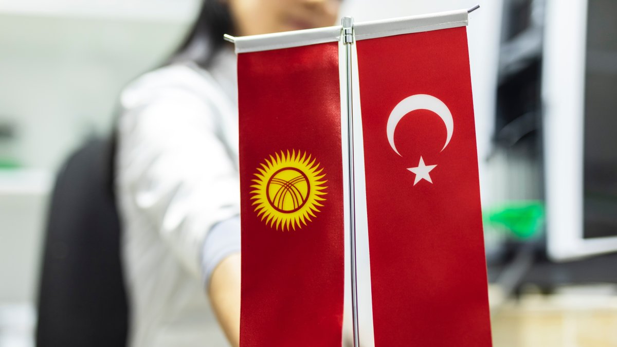 The flags of Kyrgyzstan and Türkiye are displayed together, symbolizing the friendship and strong ties between the two countries. (Shutterstock Photo) 