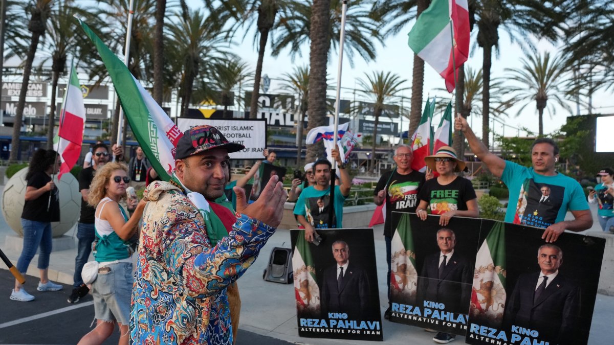 A pro-Iranian regime protestor opposite anti-regime protestors outside the Carson Sports Park, Carson, U.S., June 14, 2026. (Reuters Photo)