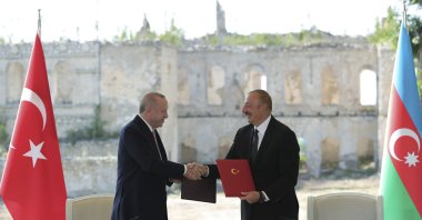 Azerbaijan's President Ilham Aliyev (R) and President Recep Tayyip Erdoğan shake hands after signing the Shusha Declaration, Shusha, Azerbaijan, June 15, 2021. (AP Photo)