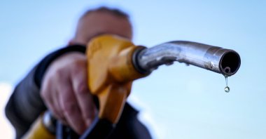 A drop of petrol falls from the nozzle of a petrol pump at a petrol station near Paris, France, March 9, 2026. (AFP Photo)