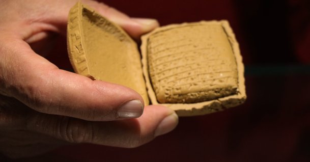 4,000-year-old clay tablet is preserved inside a mud envelope, Kayseri, central Türkiye, June 12, 2026. (AA Photo)