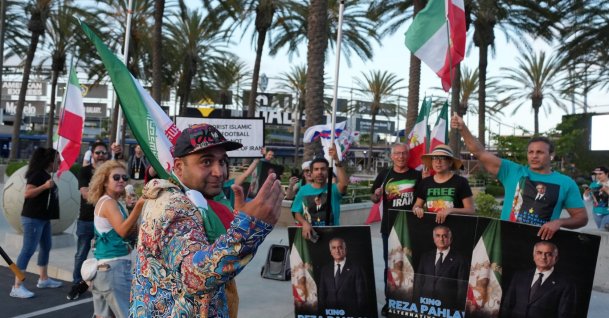 A pro-Iranian regime protestor opposite anti-regime protestors outside the Carson Sports Park, Carson, U.S., June 14, 2026. (Reuters Photo)
