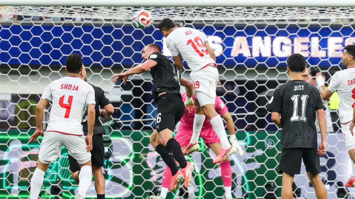 Iran defender Ali Nemati (C) goes for goal in the first half during the FIFA World Cup 2026 group stage match Iran against New Zealand, Inglewood, U.S., June 15, 2026. (EPA Photo)