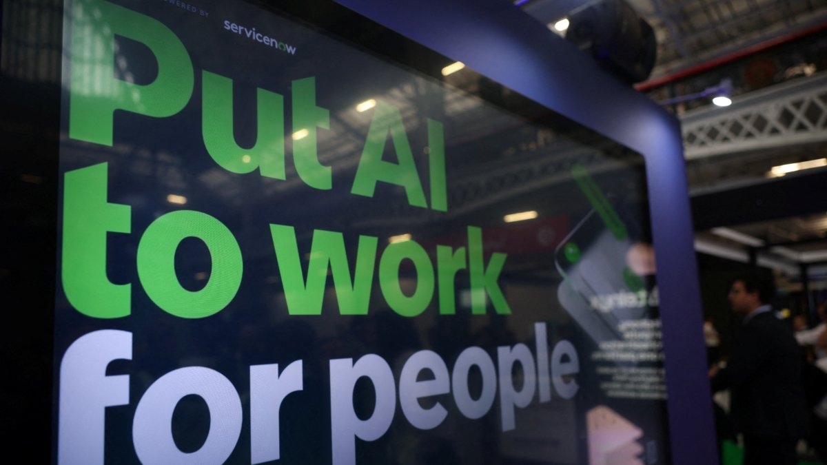 A message reading "Put AI to work for people" is displayed on a screen during the London Tech Week at Olympia, London, U.K., June 8, 2026. (Reuters Photo)
