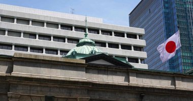 Japan's national flag flutters at the Bank of Japan headquarters building, Tokyo, Japan, June 16, 2026. (AFP Photo)