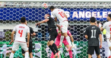 Iran defender Ali Nemati (C) goes for goal in the first half during the FIFA World Cup 2026 group stage match Iran against New Zealand, Inglewood, U.S., June 15, 2026. (EPA Photo)