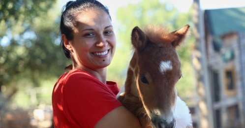 Owner Andjelka Josipovic poses with a pony named Mile at a ranch in Bale, Croatia, June 13, 2026. (AP Photo)