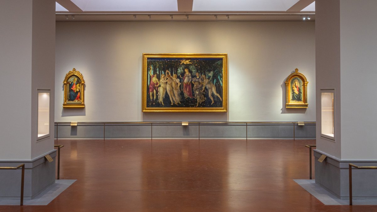 A view of the renovated and refurbished Botticelli rooms, with Renaissance master Sandro Botticelli's paintings: "Spring" (C), "Madonna of the Rose Garden" (L) and "Madonna in glory with Seraphim"  (R) displayed at Uffizi Galleries, Florence, Italy, June 16, 2026. (AP Photo)