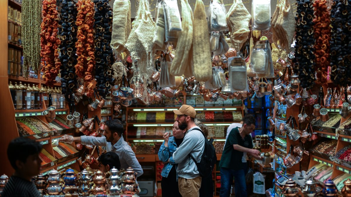 Visitors browse spices and traditional products inside a shop at the Egyptian Bazaar, Istanbul, Türkiye, May 15, 2026. (AA Photo) 