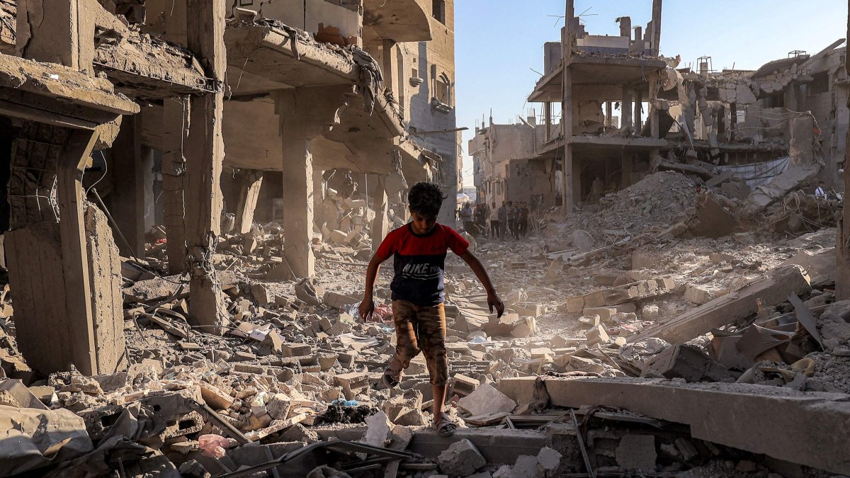  A boy walks through the rubble of a building that was destroyed following Israeli bombardment after an evacuation order, at the Maghazi camp for Palestinian refugees in the central Gaza Strip, June 12, 2026. (AFP Photo)