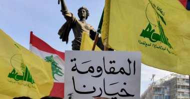 Supporters of Hezbollah carry flags and a placard bearing the Arabic phrase "Resistance is our choice” during a protest, Beirut, Lebanon, 31 May 2026 (EPA Photo)