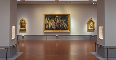 A view of the renovated and refurbished Botticelli rooms, with Renaissance master Sandro Botticelli's paintings: "Spring" (C), "Madonna of the Rose Garden" (L) and "Madonna in glory with Seraphim"  (R) displayed at Uffizi Galleries, Florence, Italy, June 16, 2026. (AP Photo)