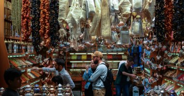 Visitors browse spices and traditional products inside a shop at the Egyptian Bazaar, Istanbul, Türkiye, May 15, 2026. (AA Photo) 