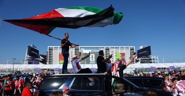 A Jordan fan stands on top of a car waving their national flag outside the stadium before the 2026 FIFA World Cup Group J match against Austria at San Francisco Bay Area Stadium, Santa Clara, California, U.S., June 16, 2026. (Reuters Photo)