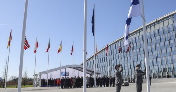 Finnish military personnel install the Finnish national flag at the NATO headquarters in Brussels, April 4, 2023. (AFP Photo)