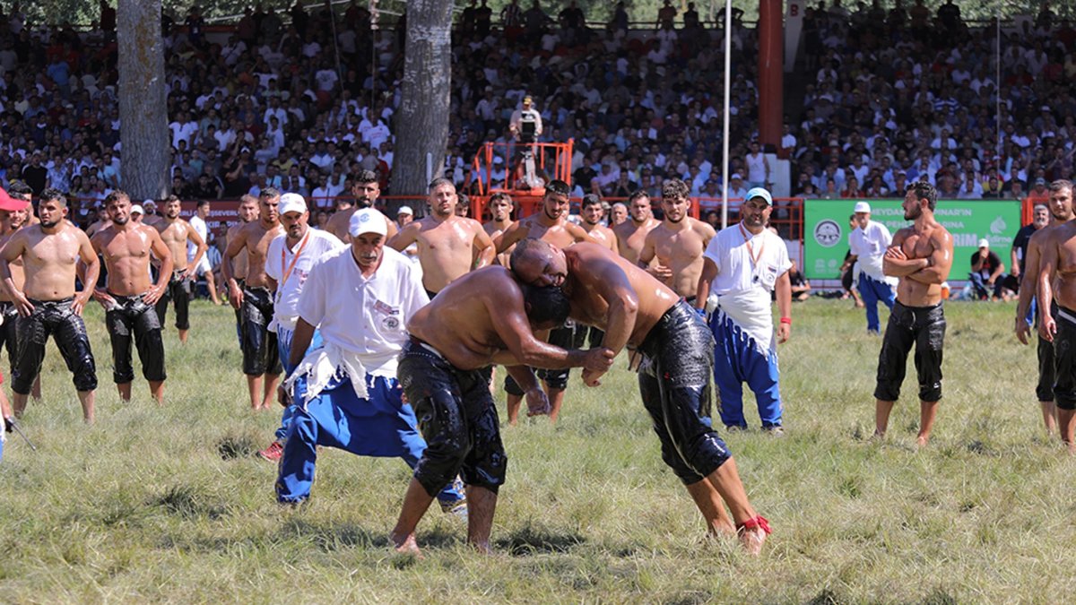 Oil wrestlers in action during the 665th Kırkpınar Oil Wrestling Festival, Edirne, Türkiye, July 2, 2022. (DHA Photo)