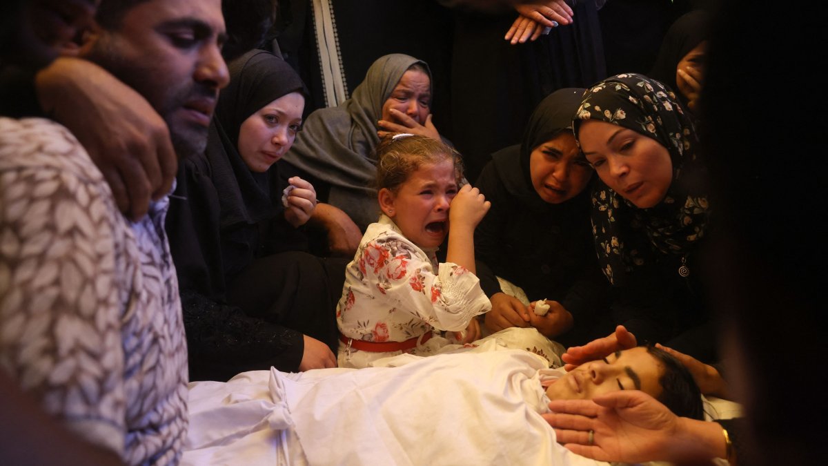 Palestinians mourn over the body of a loved one killed in an overnight Israeli strike, in Khan Younis, southern Gaza, Palestine, June 14, 2026. (AFP Photo)