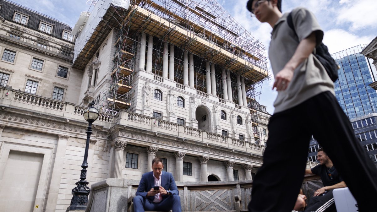 People pass the Bank of England (BoE) in the City of London financial district, London, U.K., June 18, 2026. (EPA Photo)
