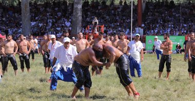 Oil wrestlers in action during the 665th Kırkpınar Oil Wrestling Festival, Edirne, Türkiye, July 2, 2022. (DHA Photo)