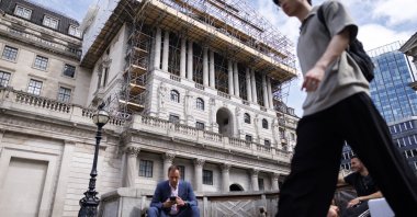People pass the Bank of England (BoE) in the City of London financial district, London, U.K., June 18, 2026. (EPA Photo)
