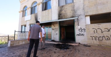 Palestinians inspect damage at a mosque in the West Bank village of Jiljilya, north of Ramallah, June 17, 2026. (EPA Photo)