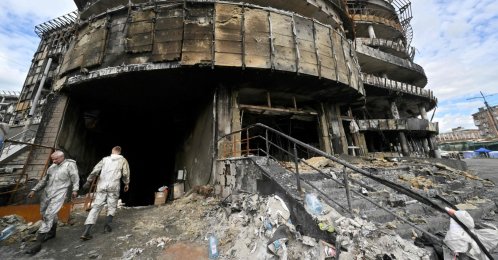 Employees work at a mall previously destroyed during a Russian drone and missile strike in Kyiv, June 18, 2026, amid the Russian invasion in Ukraine. (AFP Photo)