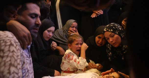 Palestinians mourn over the body of a loved one killed in an overnight Israeli strike, in Khan Younis, southern Gaza, Palestine, June 14, 2026. (AFP Photo)