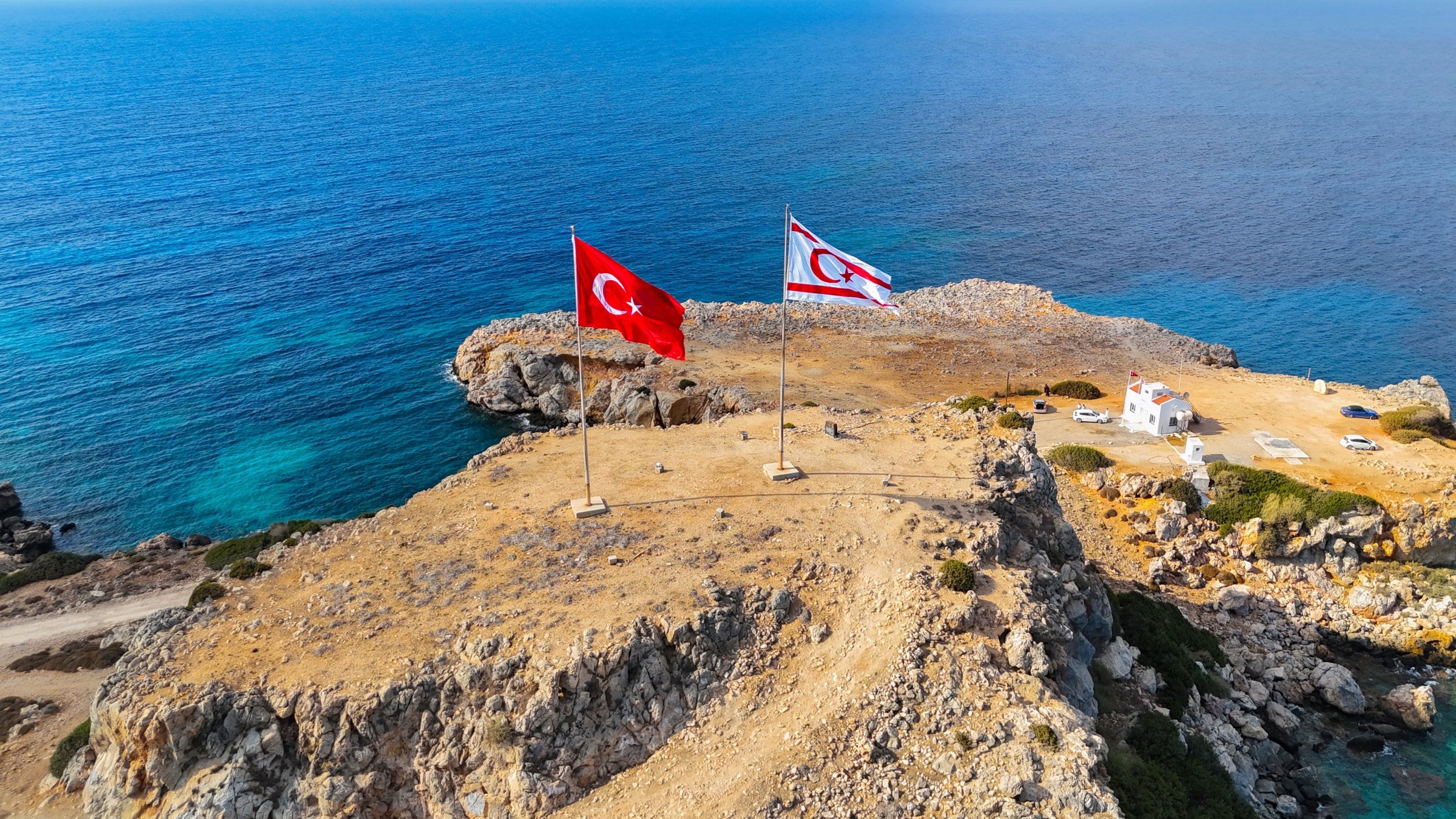 An aerial drone view shows the Turkish Republic of Northern Cyprus (TRNC) and Turkish flags flying on the Karpaz Peninsula, TRNC, Sept. 1, 2025. (Shutterstock Photo)