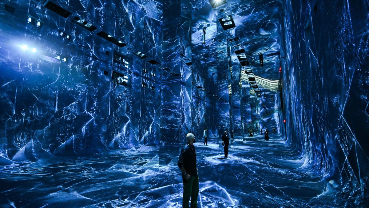 Attendees interact with immersive visualizations from the inaugural exhibition Machine Dreams: Rainforest are projected at DATALAND, the Museum of AI Arts, Los Angeles, U.S., June 9, 2026. (AFP Photo)