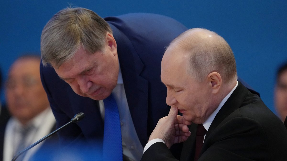 Russian President Vladimir Putin (R) speaks to his foreign policy aide Yuri Ushakov during the summit of the Supreme Eurasian Economic Council in Astana, Kazakhstan, May 29, 2026. (Reuters Photo)