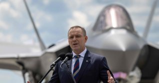 Poland's President Karol Nawrocki speaks during the ceremony for official entry into service with the Polish Air Force of the first three U.S.-made F-35 aircraft, in Lask, central Poland, June 12, 2026. (AFP Photo)
