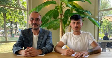 Engin Arslan (R), who was held for 13 months in a Damascus prison after traveling toward Palestine, poses with producer Melik Akkaya, Istanbul, Türkiye, June 18, 2026. (AA Photo)