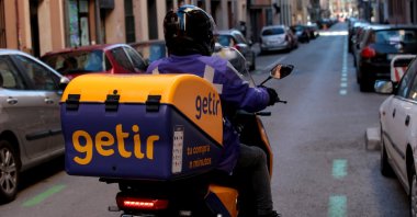 A Getir courier drives through a street in Madrid, Spain, Dec. 30, 2021. (AA Photo)