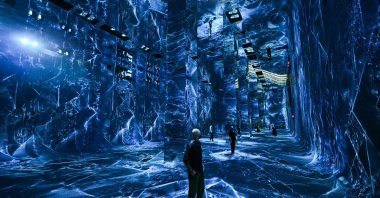 Attendees interact with immersive visualizations from the inaugural exhibition Machine Dreams: Rainforest are projected at DATALAND, the Museum of AI Arts, Los Angeles, U.S., June 9, 2026. (AFP Photo)