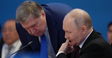 Russian President Vladimir Putin (R) speaks to his foreign policy aide Yuri Ushakov during the summit of the Supreme Eurasian Economic Council in Astana, Kazakhstan, May 29, 2026. (Reuters Photo)