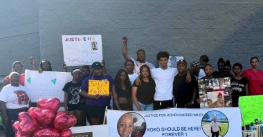 In this photo provided by Marquell Bridges, a group of mourners attend a makeshift memorial for 1-year old Kohen Wiley, outside the Walmart where the boy was shot by police in Senatobia, Miss., Wednesday, June 17, 2026. (AP Photo)