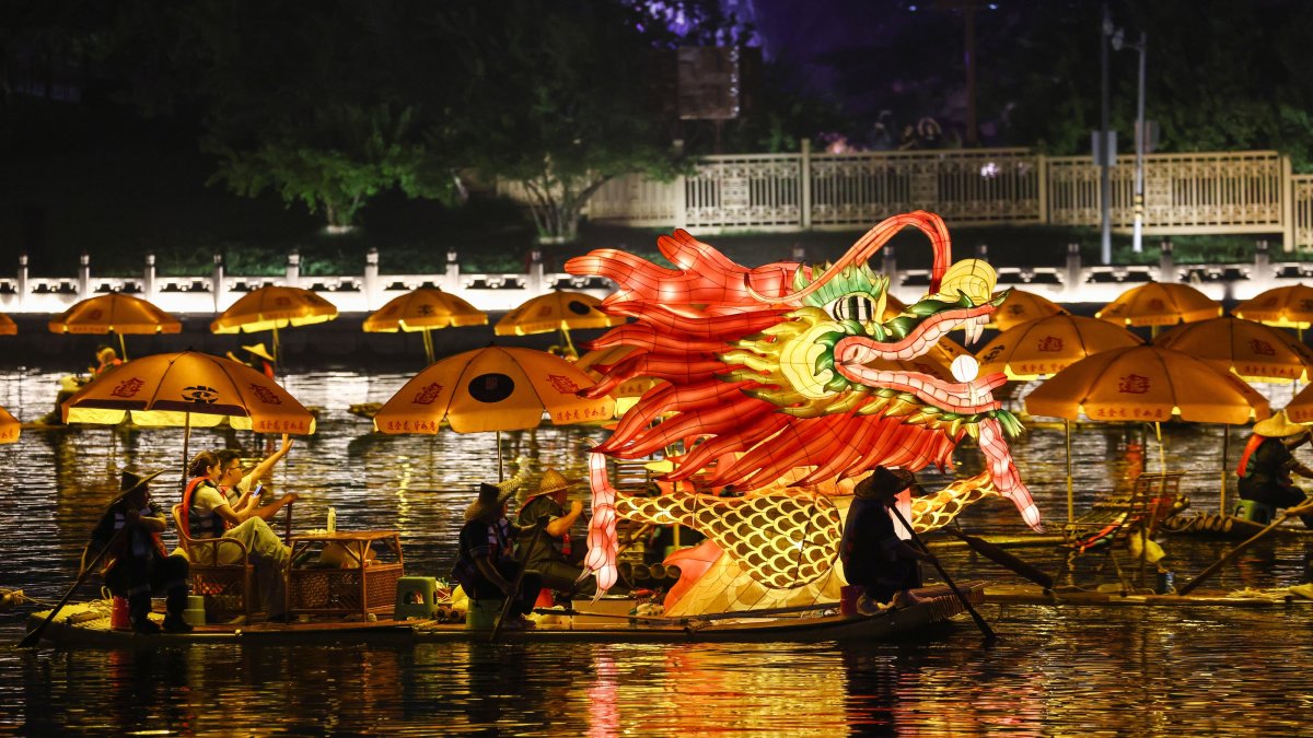 Bamboo rafts forming a golden dragon sail along the Great Canal during the Dragon Boat Festival in the Tongzhou district of Beijing, China, June 19, 2026. (EPA Photo)