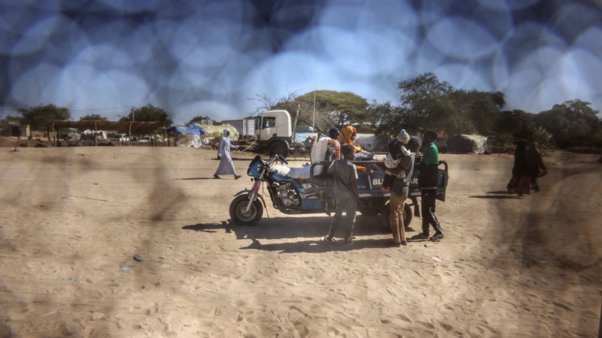 A Sudanese refugee family rides on a motorized cart travelling between Chad and Sudan, Tine, eastern Chad, Nov. 22, 2025. (Reuters Photo)