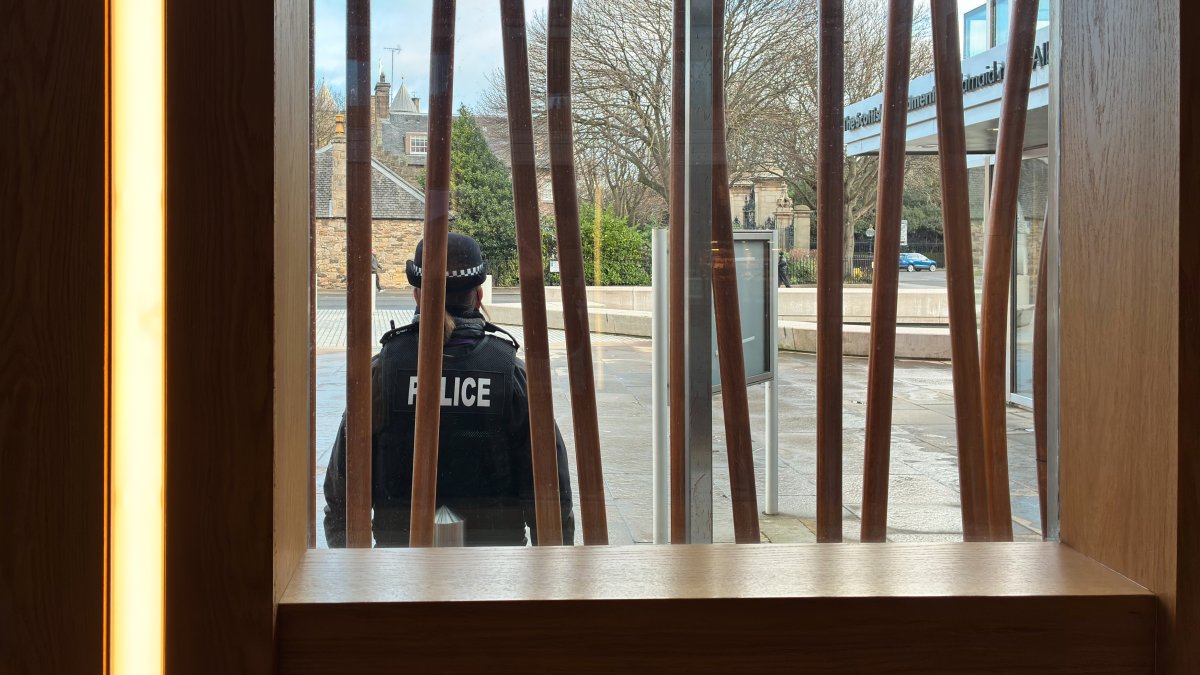 A police officer stands in front of the Scottish Parliament Building, in Edinburgh, Scotland, U.K., Dec. 19, 2025. (Getty Images Photo)