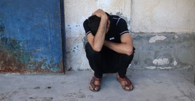 A friend of Al Jazeera video journalist Ahmed Wishah, who was killed in an Israeli strike, mourns at Al-Aqsa Martyrs Hospital in Deir al-Balah, in the central Gaza Strip, Palestine, June 21, 2026. (AFP Photo)