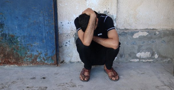 A friend of Al Jazeera video journalist Ahmed Wishah, who was killed in an Israeli strike, mourns at Al-Aqsa Martyrs Hospital in Deir al-Balah, in the central Gaza Strip, Palestine, June 21, 2026. (AFP Photo)